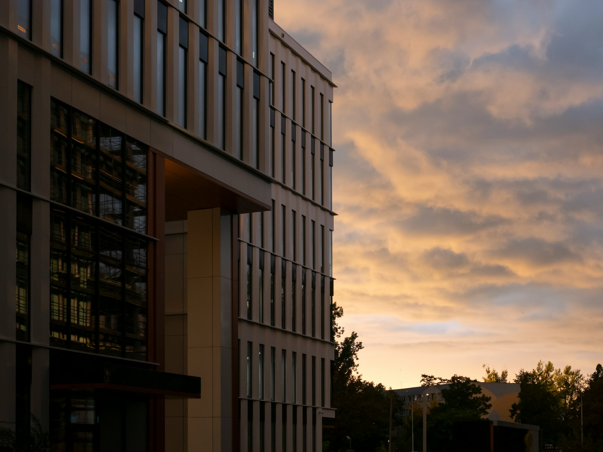 a very tall building sitting next to a tall building